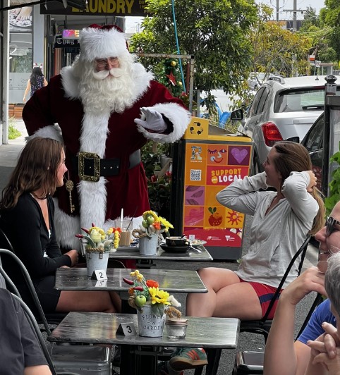 Santa chatting during a roaming café visit