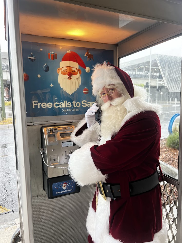 Santa at a public payphone